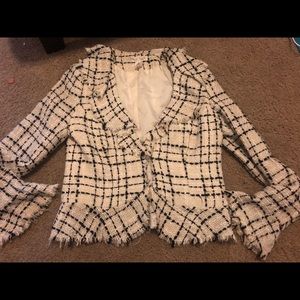 Cream colored blazer with black thread